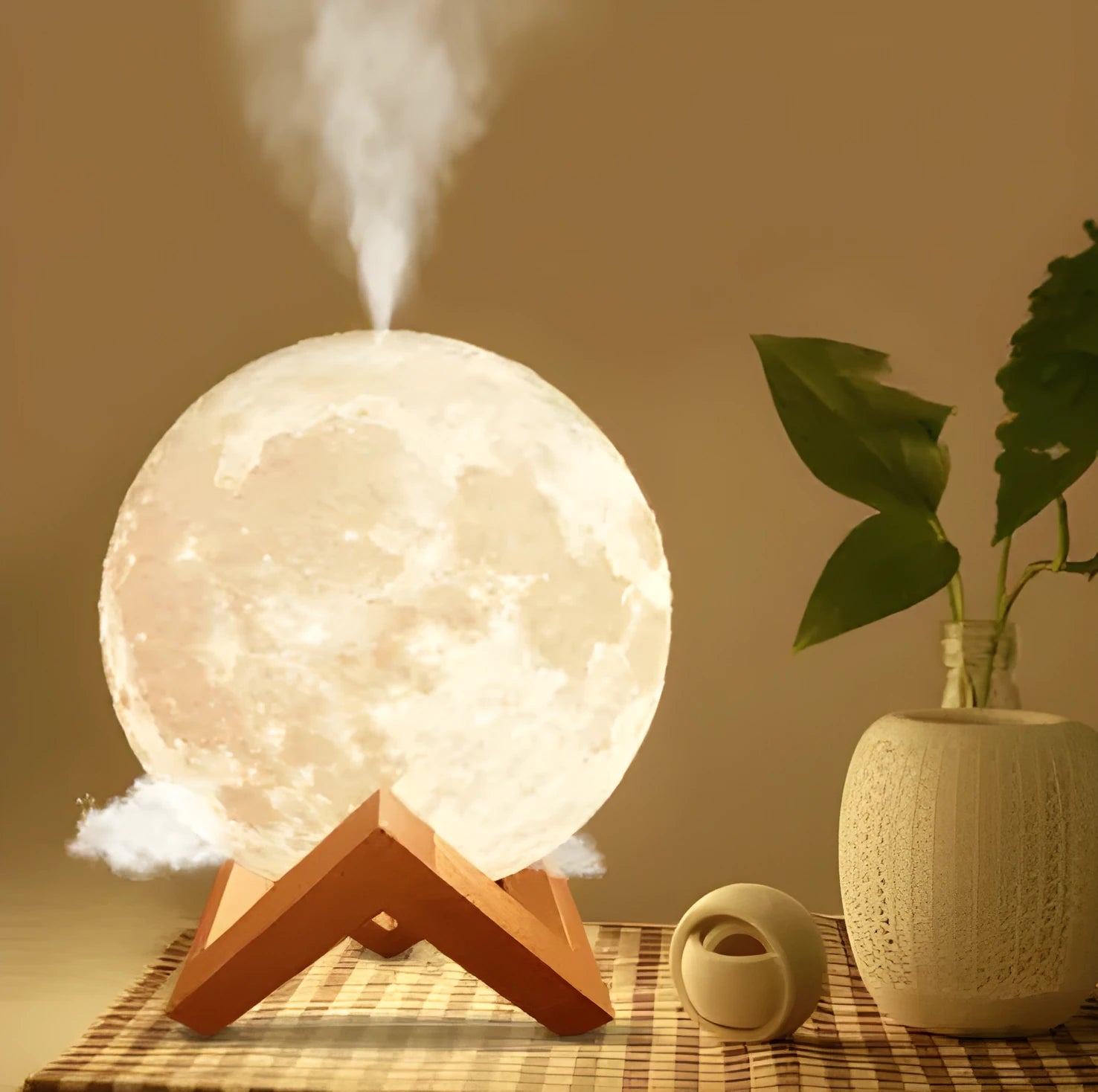 Wood coloured spherical Lunar humidifier night light on a bedside table emitting mist and soft white light.