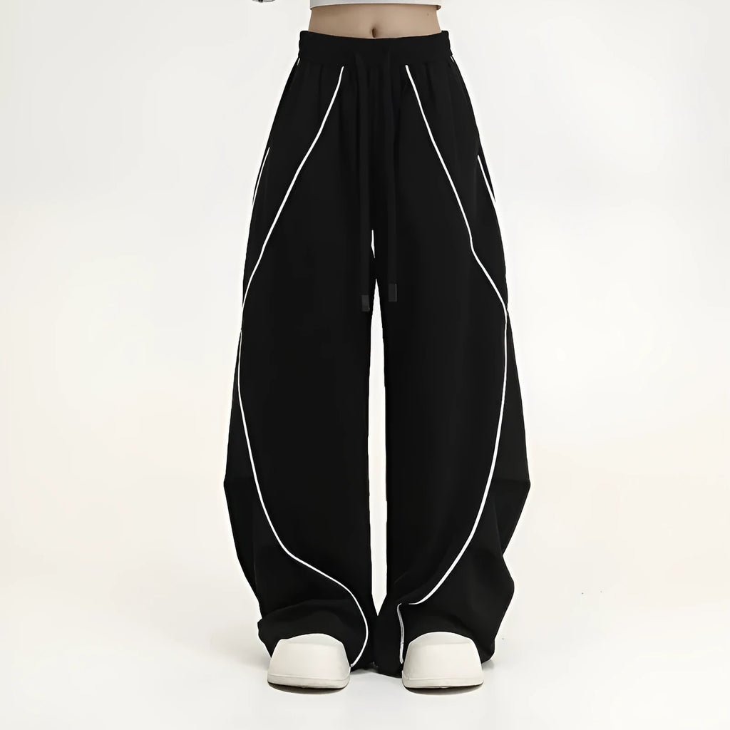 Black pleated wide-leg hip hop sports pants with stripe pattern laid flat