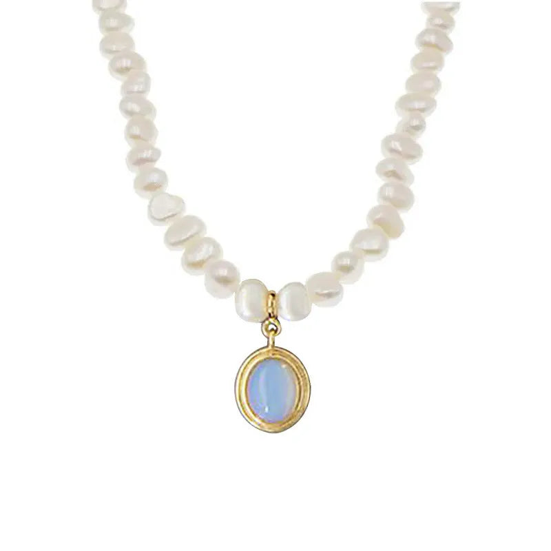 Silver necklace with geometric pendant and irregular pearls on adjustable chain