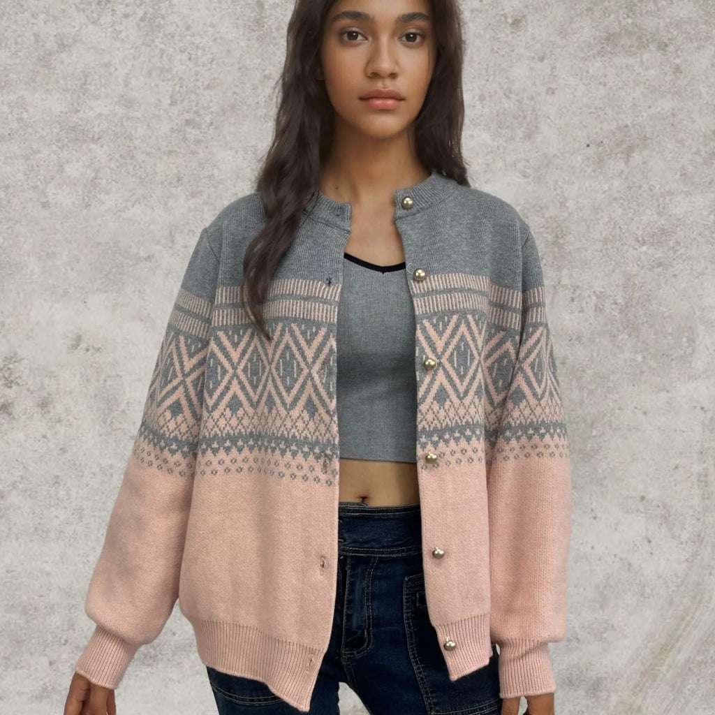 Women's grey alpaca wool cardigan with a red and white diamond knit pattern and long sleeves.