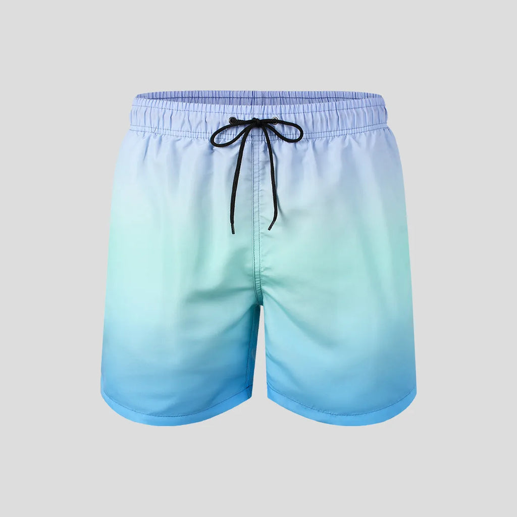 Men's grey and blue gradient printed mesh sport shorts on a white background.