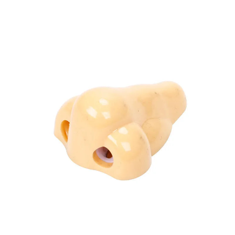 Flesh colour plastic manual pencil sharpener with geometry shape measuring 58x45x30mm for student stationery