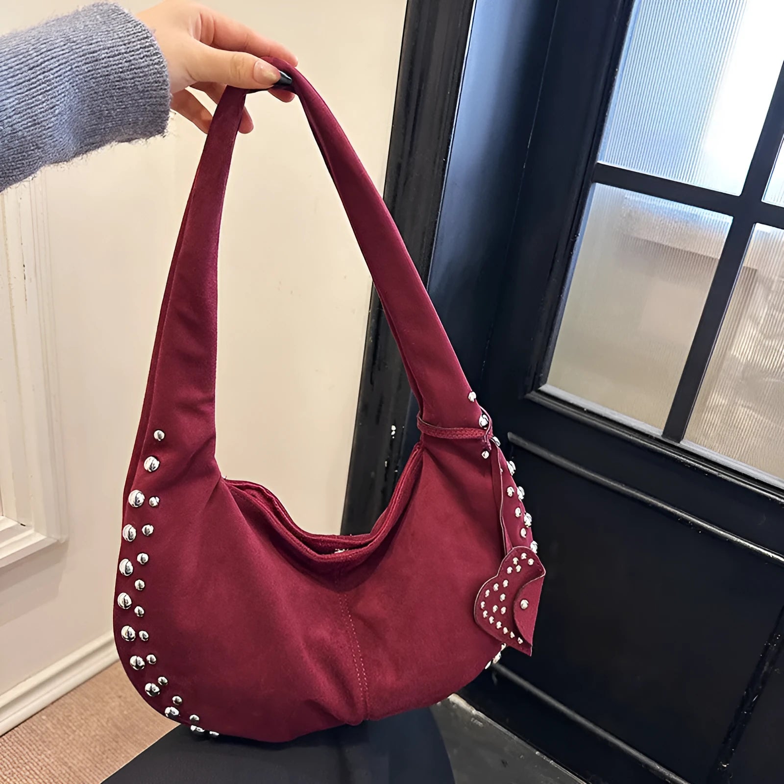 Women's soft plush underarm tote handbag in retro styling showing black, red, brown and green colour options
