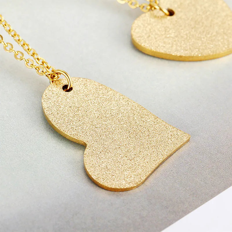 Women's titanium steel necklace with geometric heart-shaped pendant in colour KN25736-Z