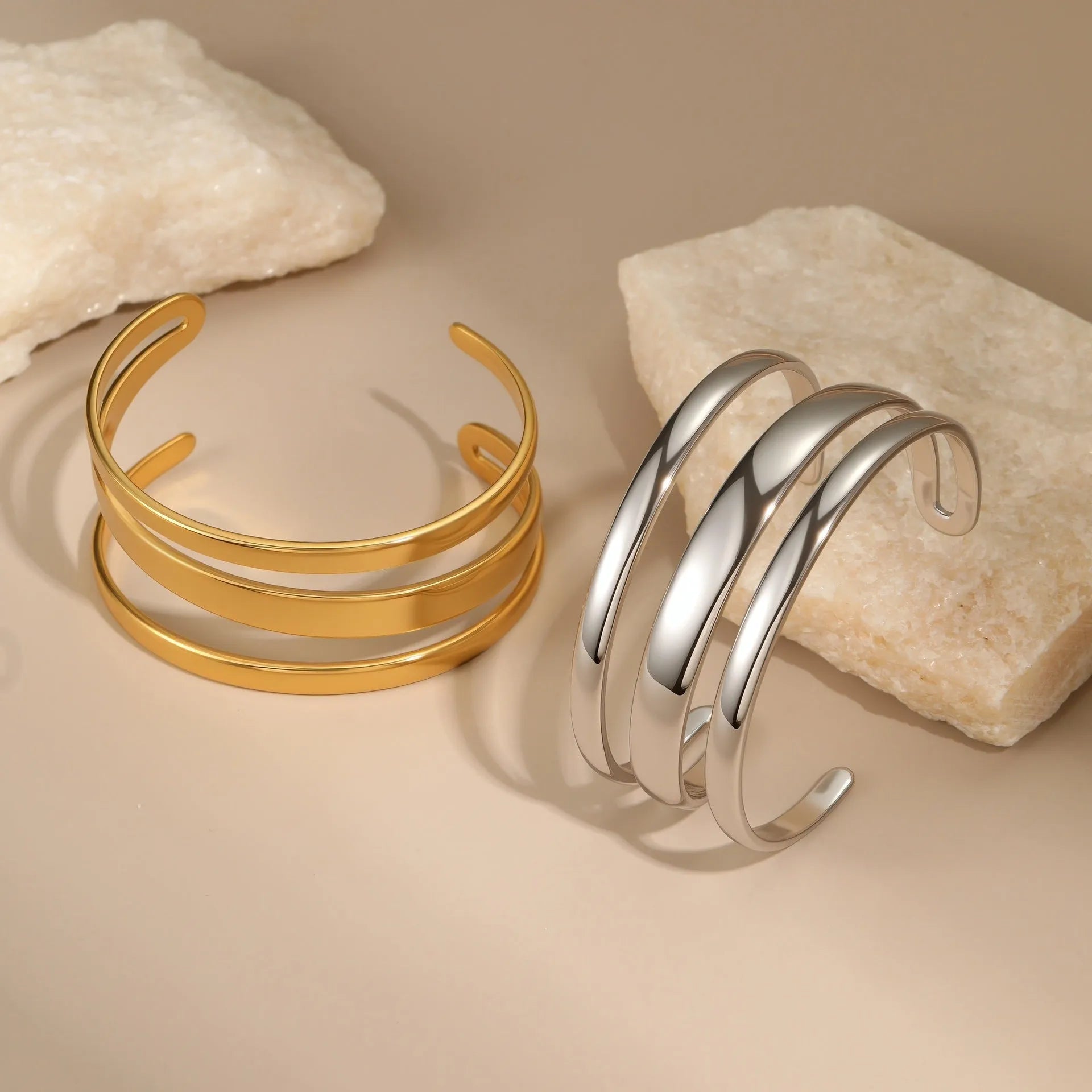 Women's stainless steel geometric bracelet with simple opening in gold or steel electroplated finish.