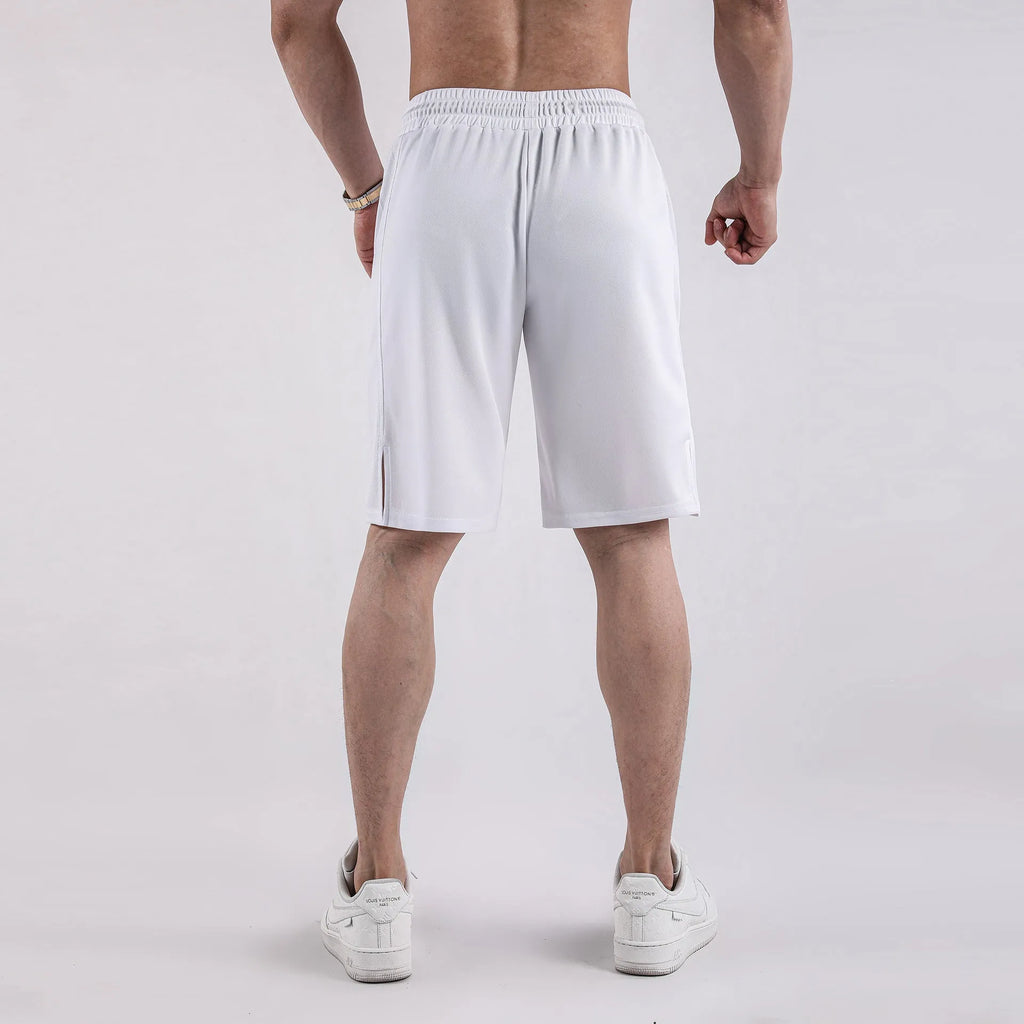 Man wearing loose-fitting black quick-dry mesh shorts with an elasticated waist.