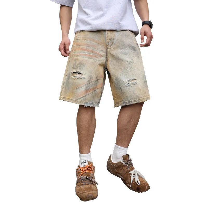 Men's light blue washed denim shorts with ripped details and a straight-leg cut