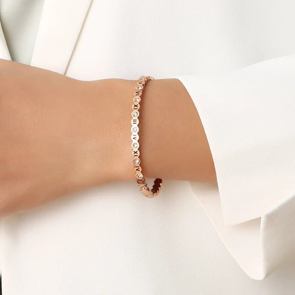 Korean style titanium steel bracelet in gold, rose gold or steel colour with number design details.