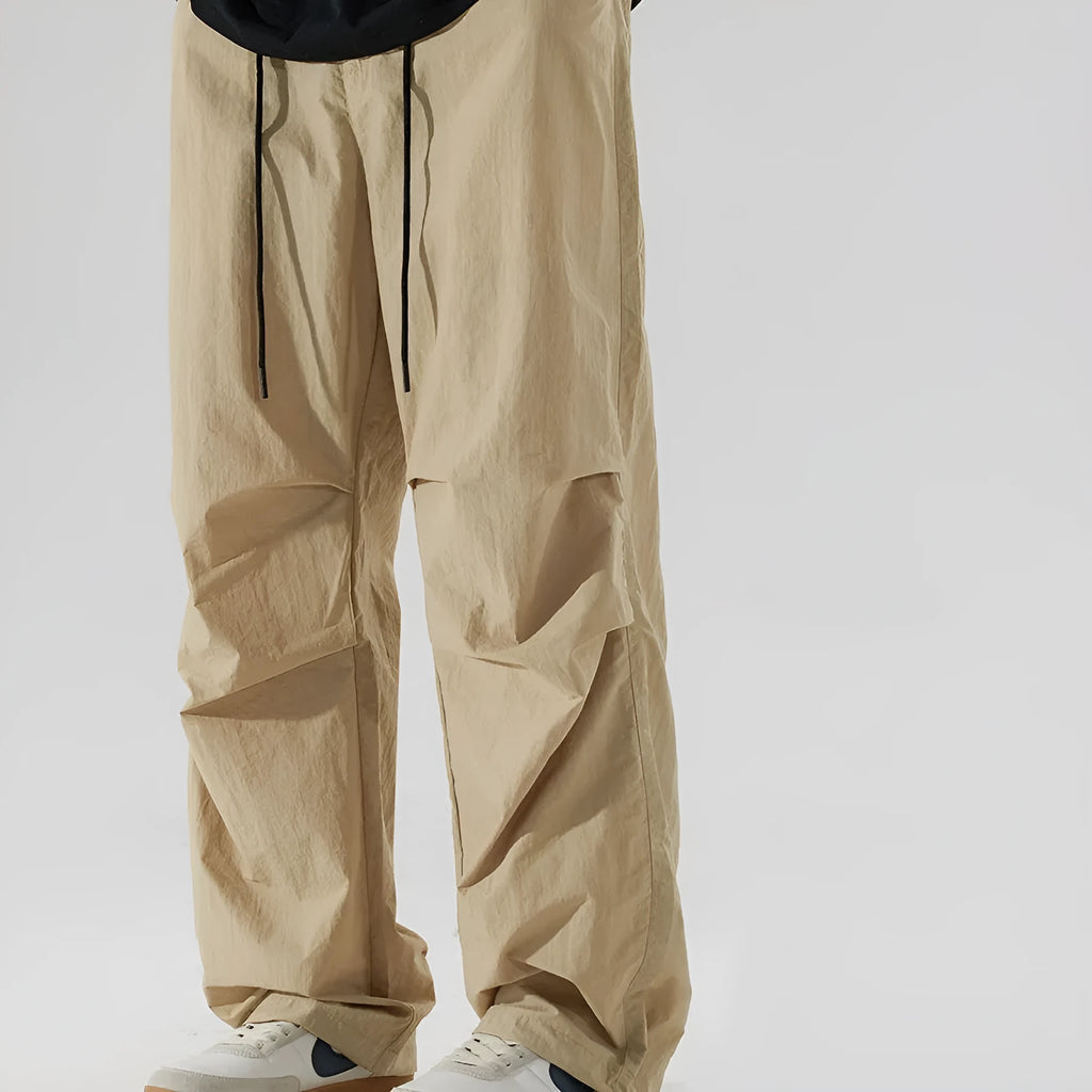 Men's thin ice silk nylon trousers in loose straight fit showing multiple colour options