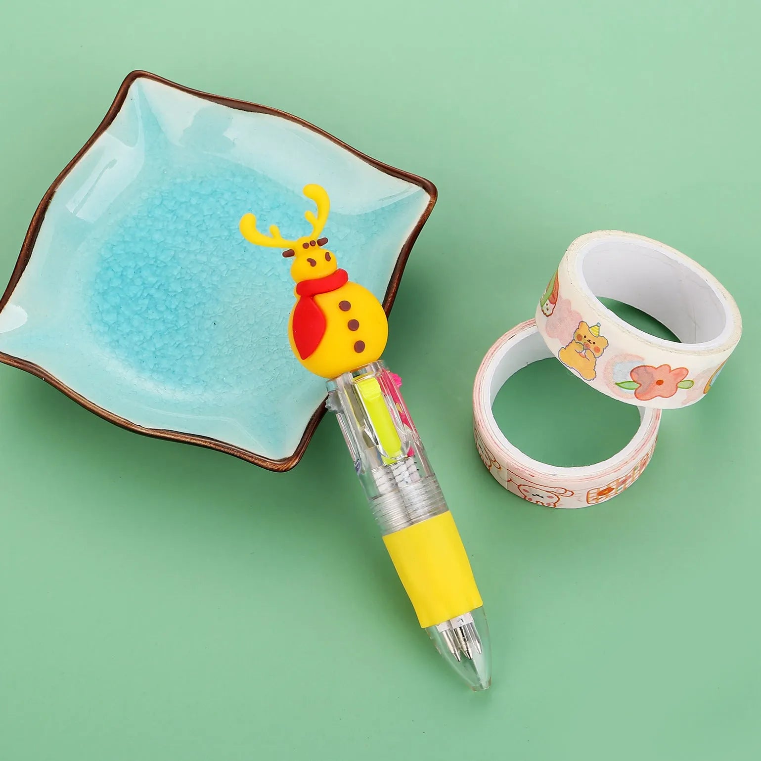 Christmas mini four-colour press-action ballpoint pen with festive designs measuring 11 cm.