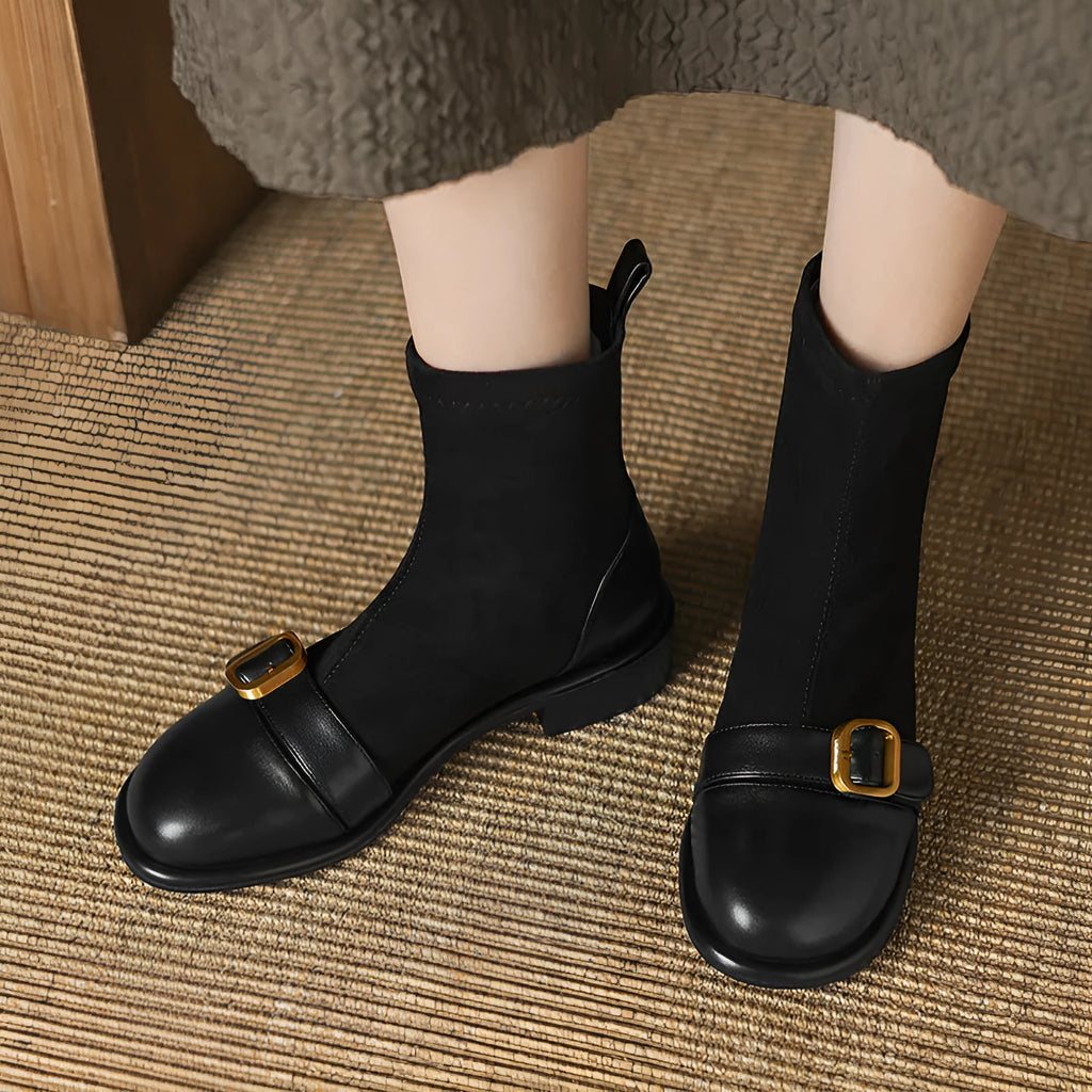 Black women's low heel Martin boots with front lace-up and decorative belt buckle stitching on a round toe.