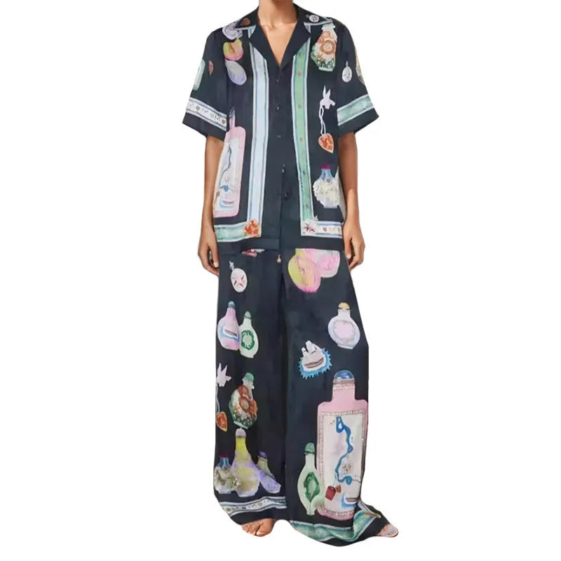 Black women's cardigan and pants set with cartoon animation print.
