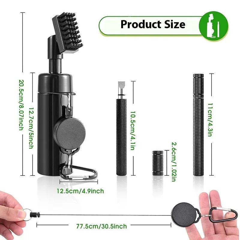 Black plastic golf club groove cleaning tool on a grassy surface with a golf ball nearby