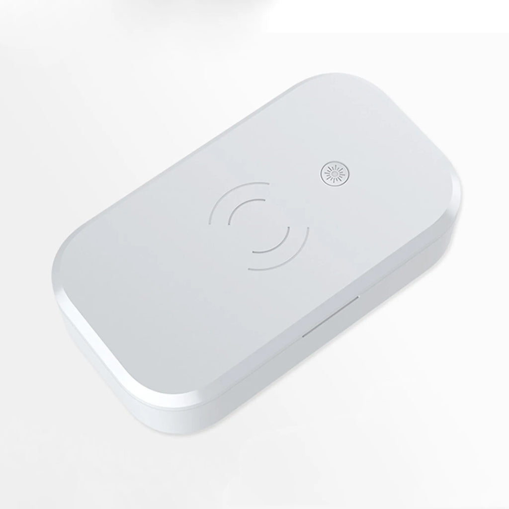 White ultraviolet disinfection box for sterilising nail tools and wirelessly charging a mobile phone.