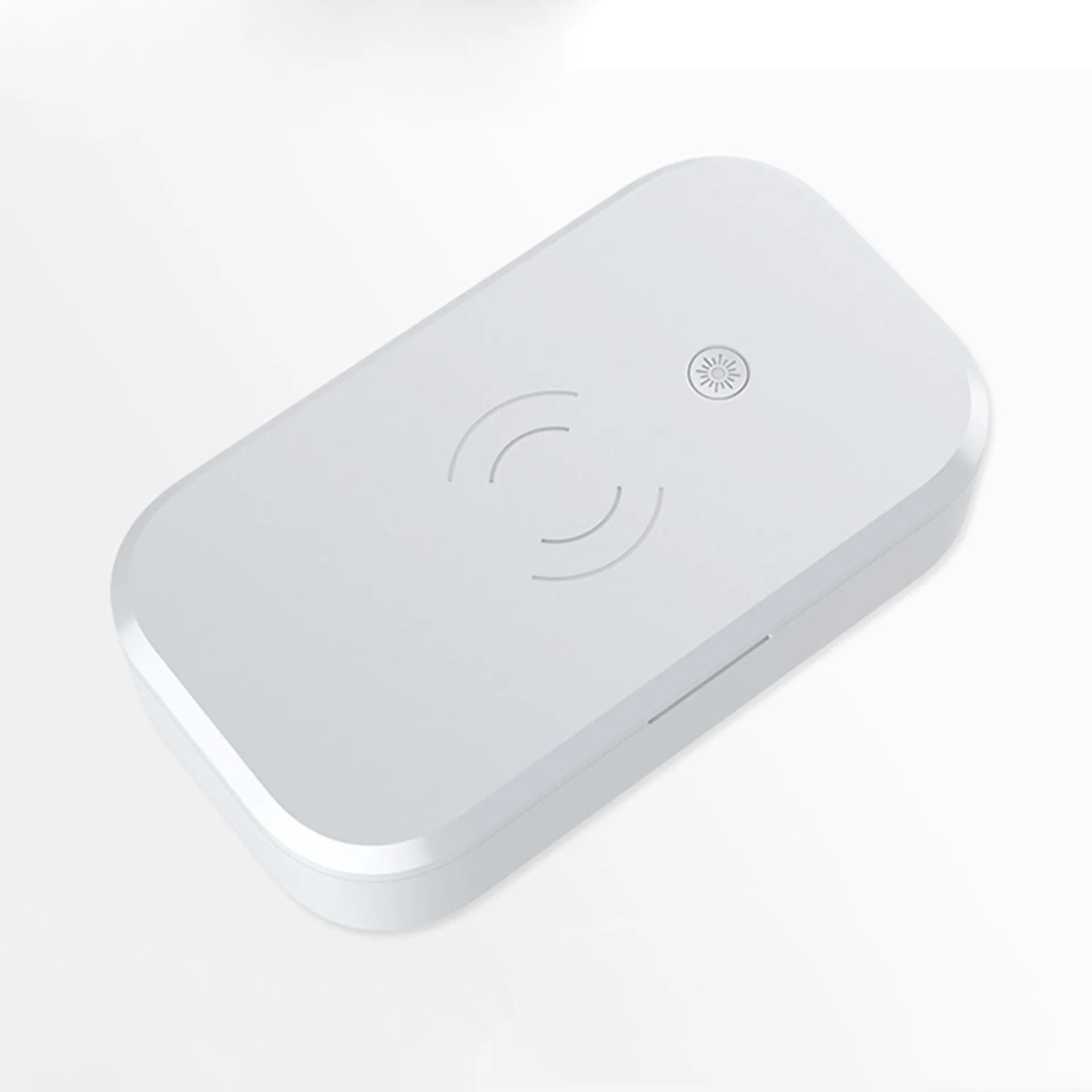 White ultraviolet disinfection box for sterilising nail tools and wirelessly charging a mobile phone.