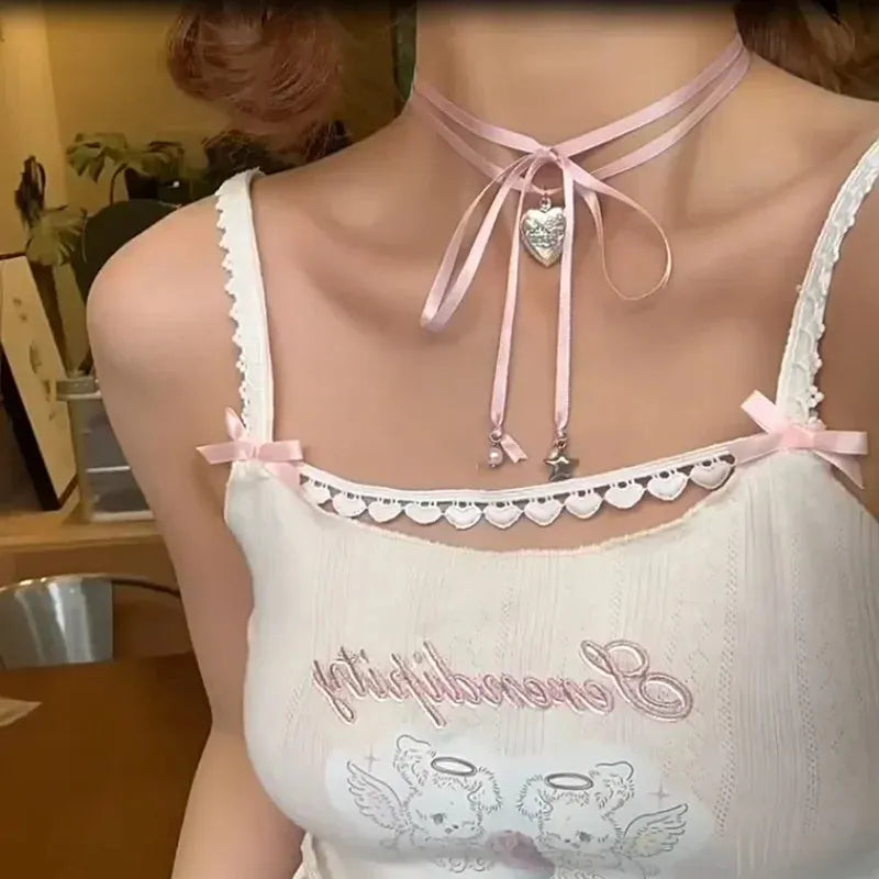 Women's alloy fashion necklace with ribbon design and a love pendant on a clavicle chain.