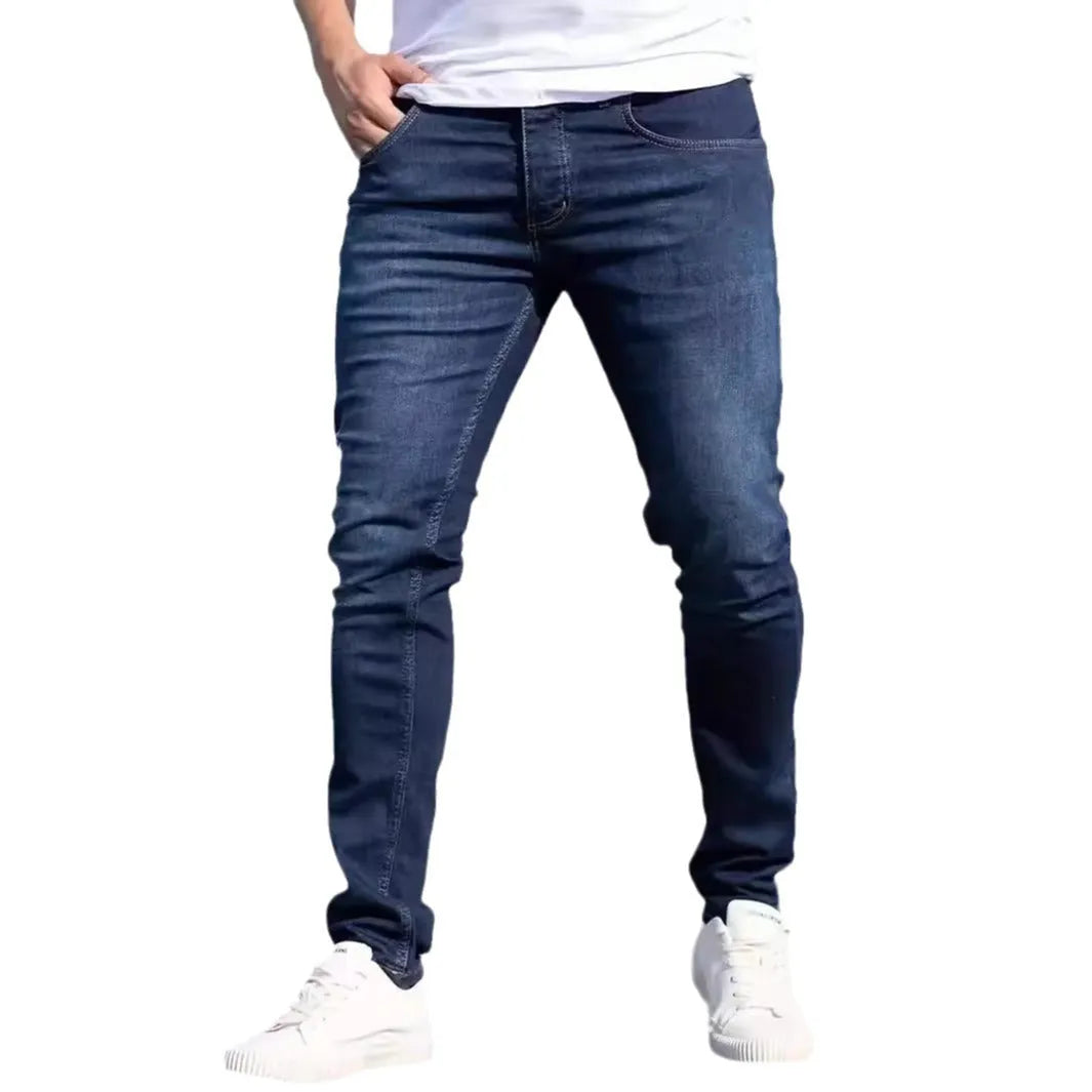 Men's dark blue skinny jeans with medium stretch cotton fabric and zipper fly