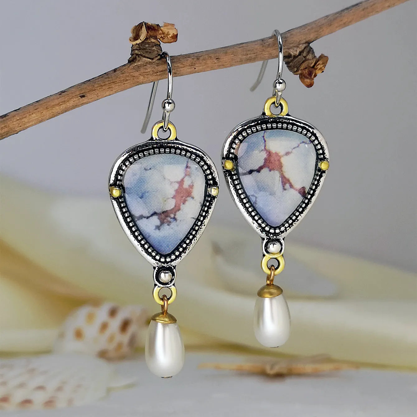 Bohemian geometric drop earrings with synthetic blue opal and white pearls on retro blue electroplated metal