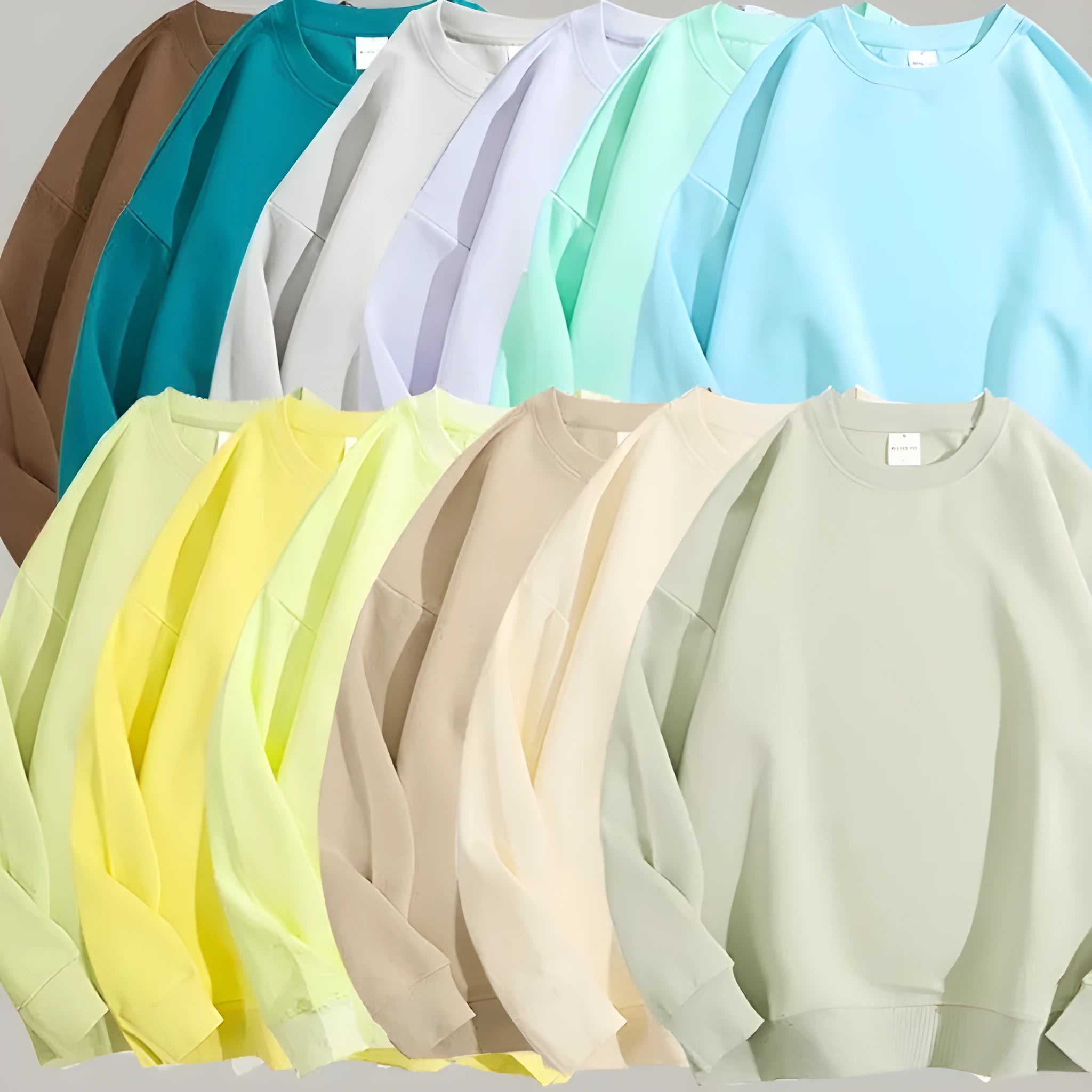 A loose-fitting, off shoulder cotton pullover sweater in a solid colour with long sleeves.