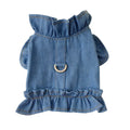 Blue denim dog dress with ruffles and a chest harness leash hook on a mannequin.