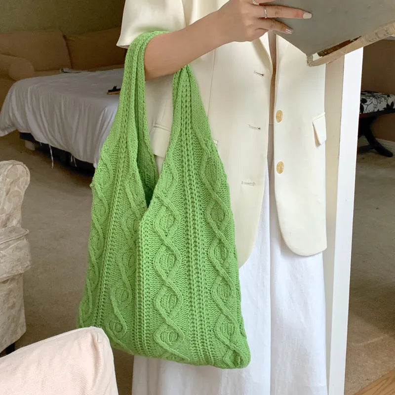 Women's retro style hollow knitted polyester tote bag in a solid colour, showing large open top and textured yarn material.