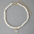Silver necklace with geometric pendant and irregular pearls on adjustable chain