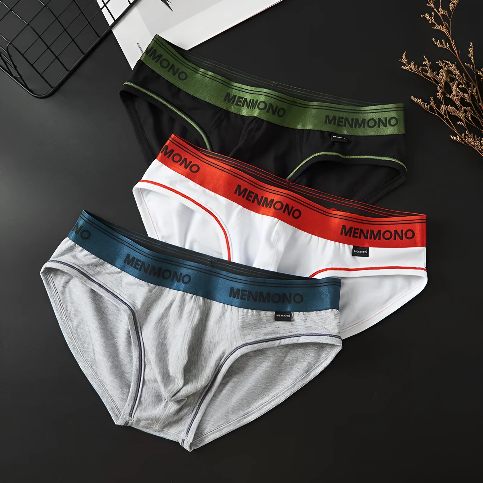 Men's low waist cotton briefs in a grey and red colour combination on a white background.