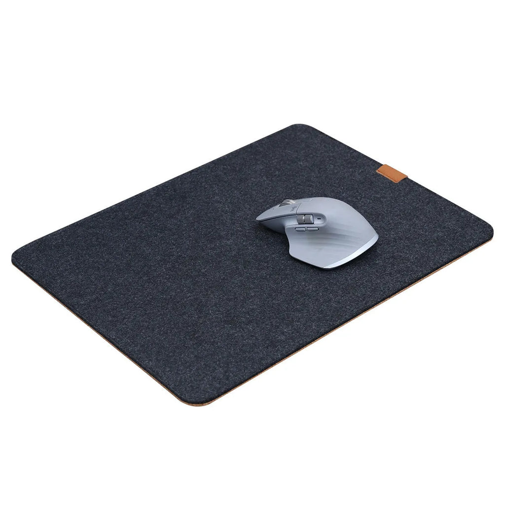 Japanese style simple desk mat in grey felt and cork, shown with keyboard and mouse.