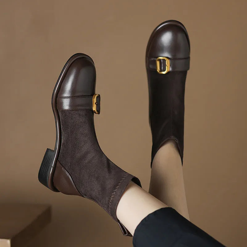 Black women's low heel Martin boots with front lace-up and decorative belt buckle stitching on a round toe.