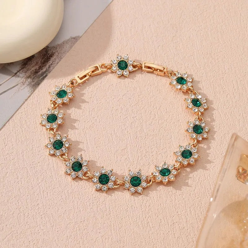 Close-up of a floral-shaped zinc alloy bracelet with an electroplated finish and crystal details.