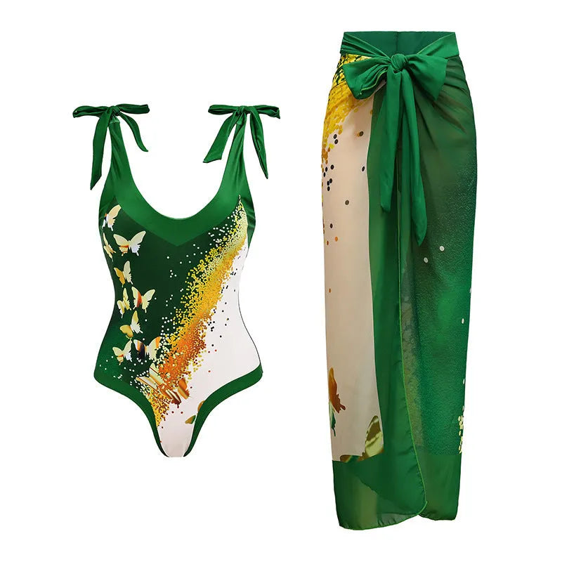 Women's solid colour one-piece swimsuit with spaghetti straps and a matching detachable skirt.