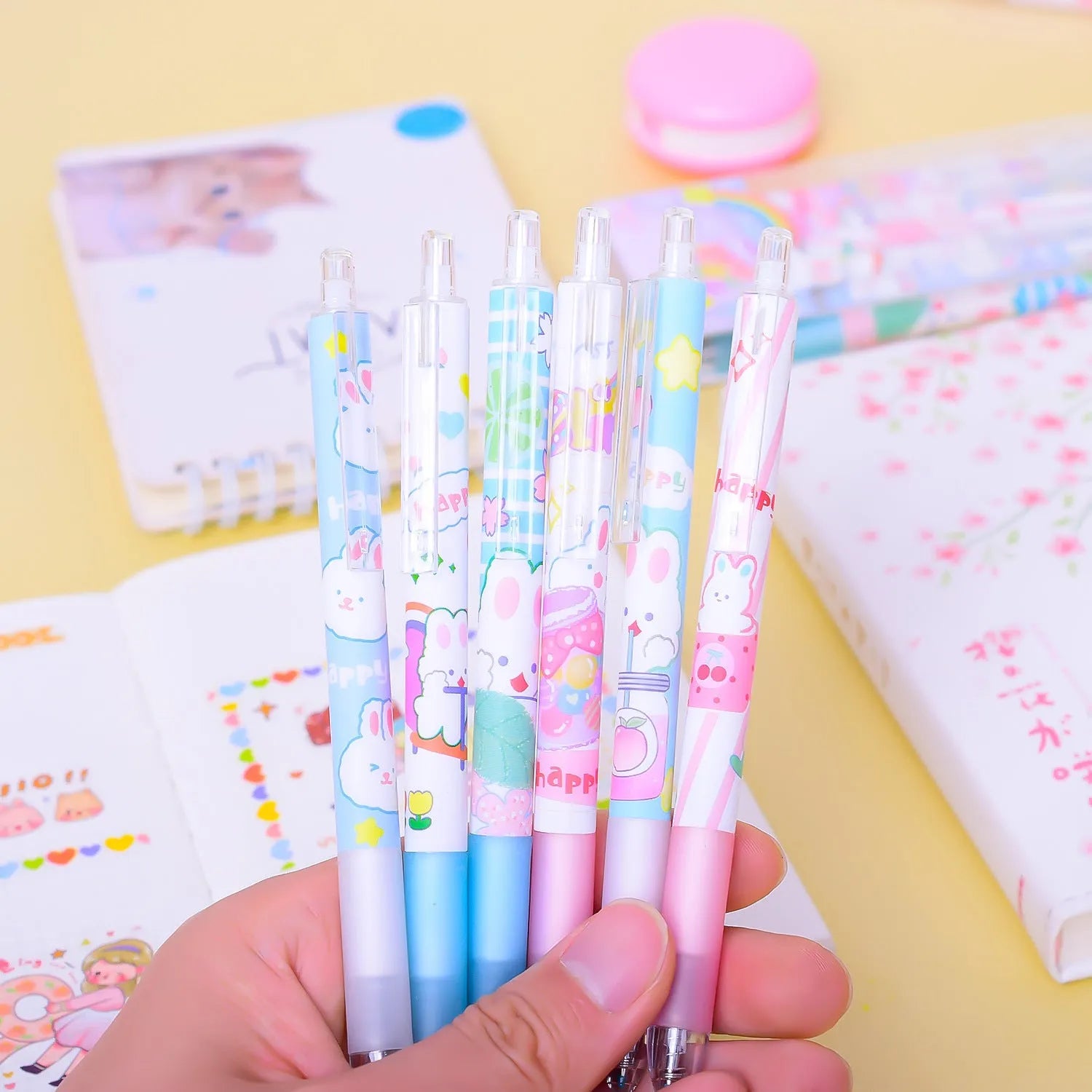 Six black plastic pens with cartoon bunny designs and 0.5mm tips laid side by side.