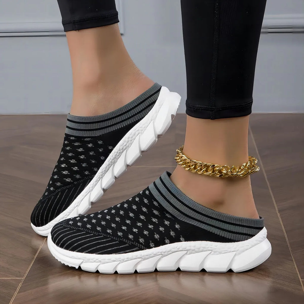 Women's Flyknit semi-slipper casual shoes in striped pattern with hollowed-out details, shown in black, pink, and purple.