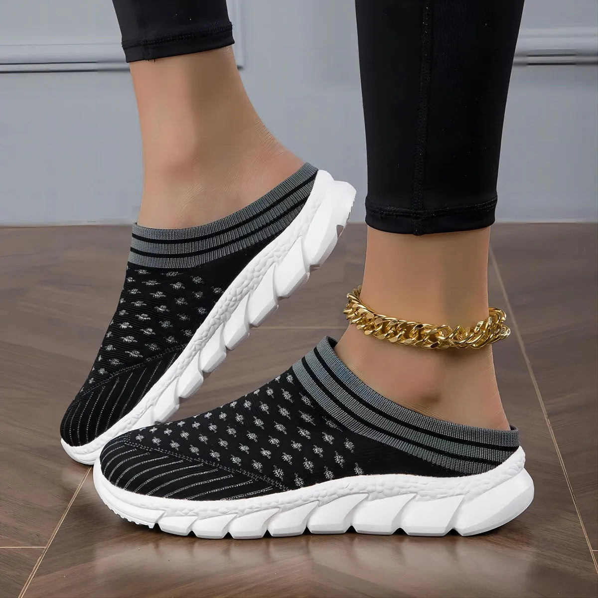 Women's Flyknit semi-slipper casual shoes in striped pattern with hollowed-out details, shown in black, pink, and purple.