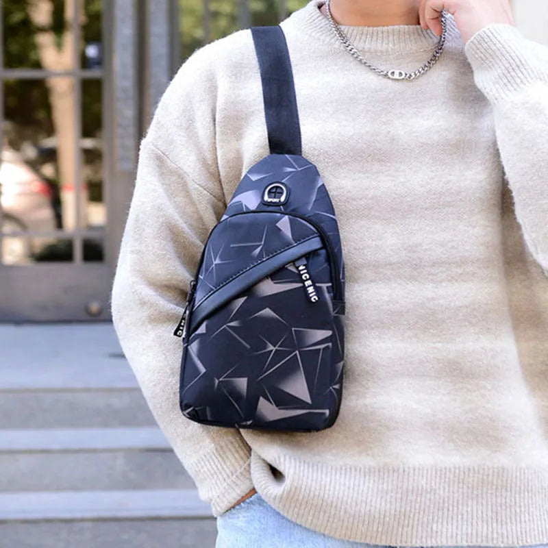 Black print sling chest crossbody bag with earphone hole and zipper pocket.