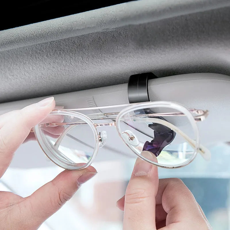 Black plastic car sunshade clip for organising glasses, tickets and identification cards
