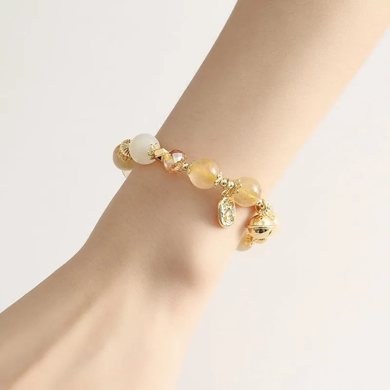 Lucky Fortune gold coloured Korean style bracelet with a single rutilated quartz crystal bead.
