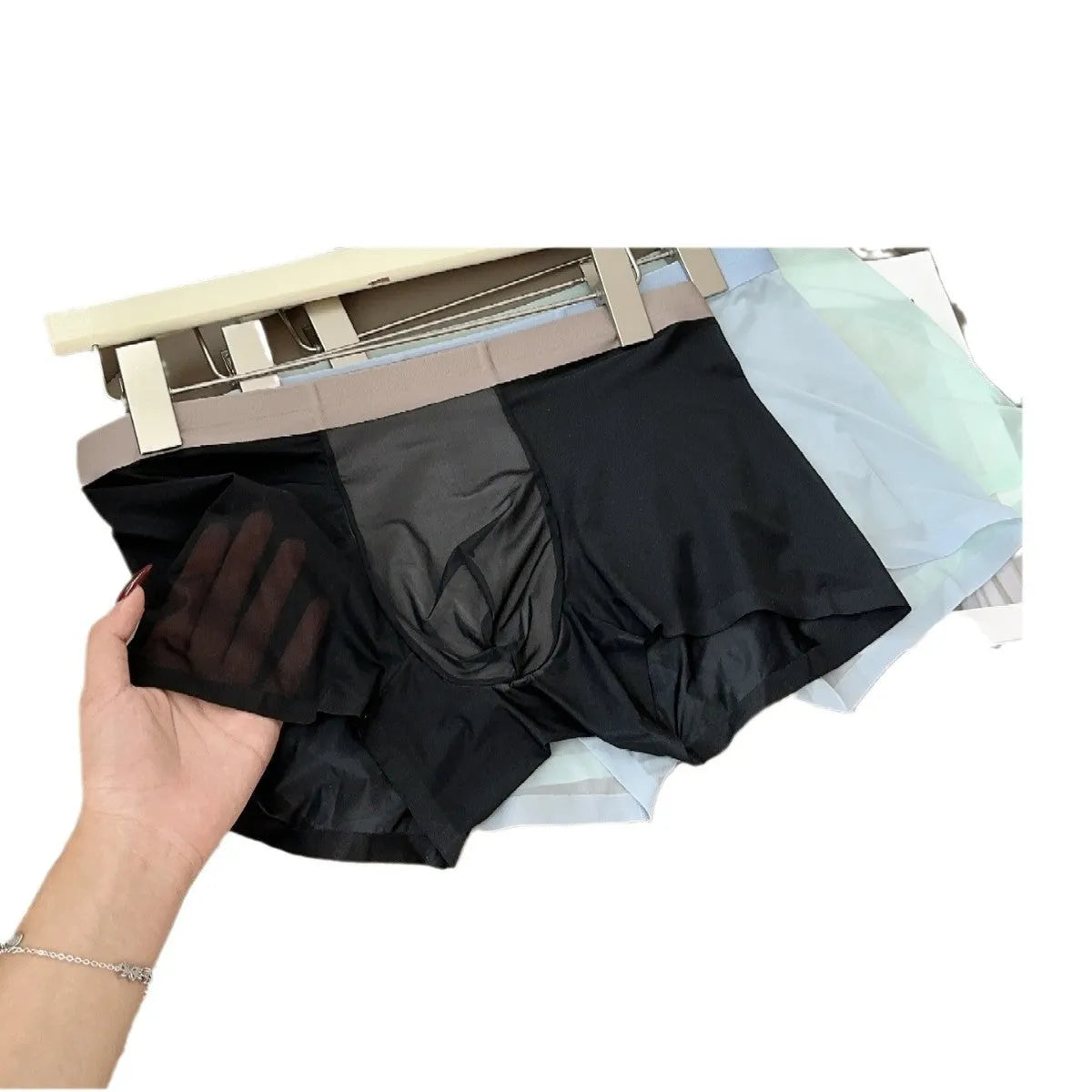 Seamless ultra-thin men's boxer shorts in Ice Silk fabric showing honeycomb crotch detail.