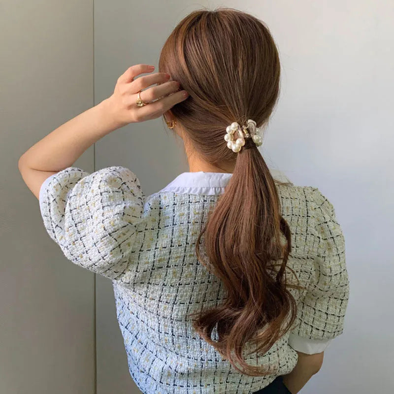Women's pearl hair barrette in big pearl colour, manual finish, front view