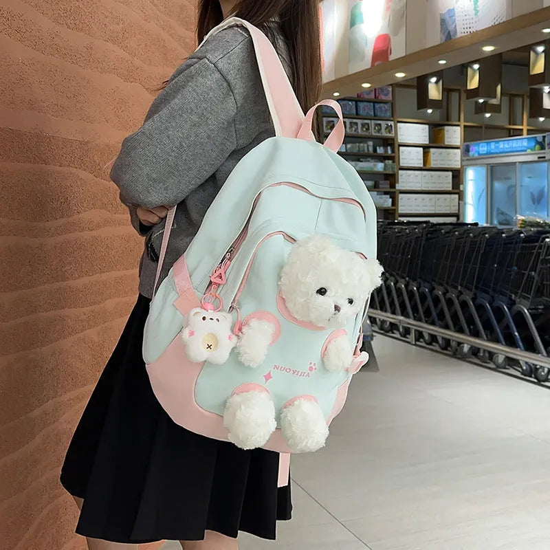 Nylon school backpack in macaron colour with curved shoulder strap and pendant, 20-35L capacity