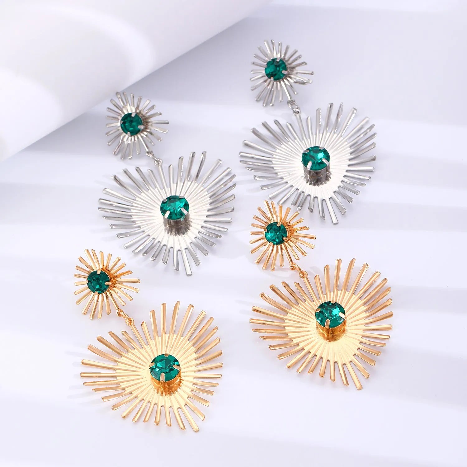 Alloy bohemian sunflower heart-shaped earrings with rhinestones in gold finish on white background
