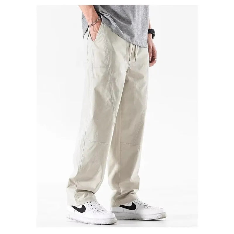 Cotton wide-leg trousers in milky white and black colours with loose fit design