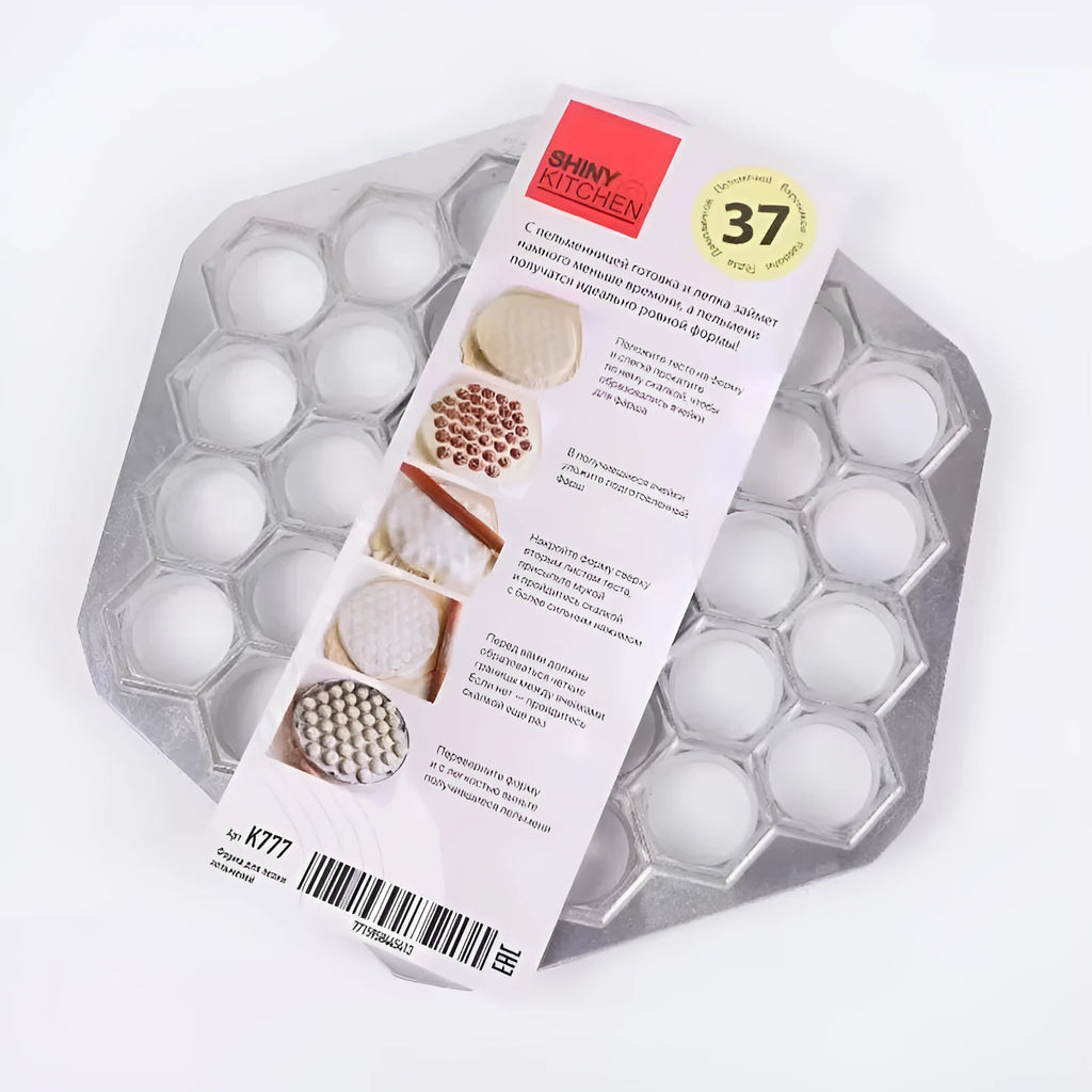 Aluminum alloy 37 hole dumpling mold for pressing multiple dumplings simultaneously on a kitchen counter