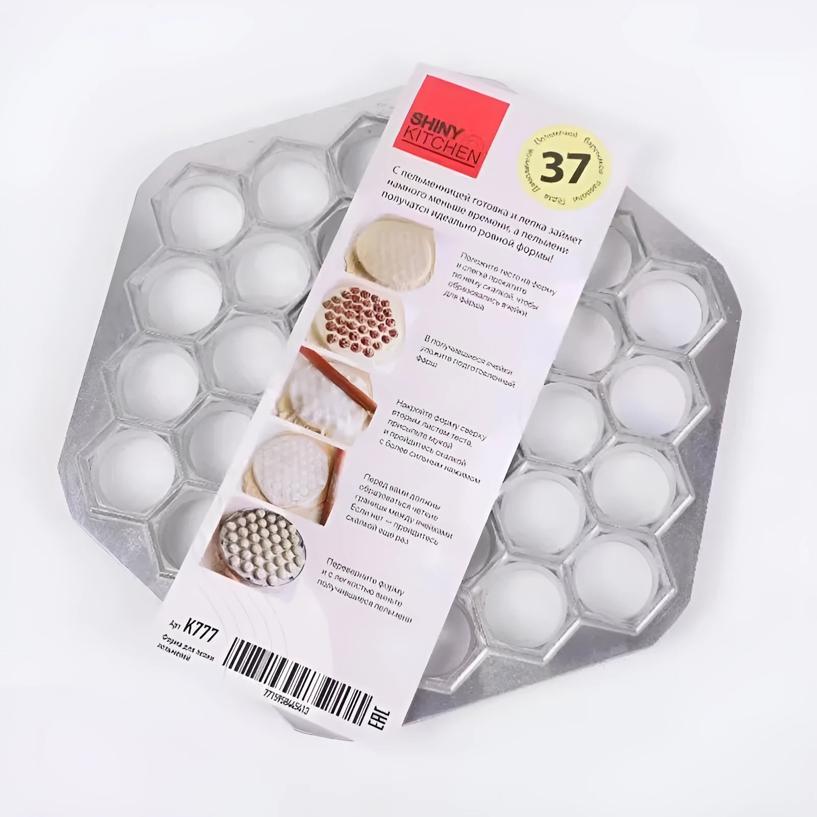 Aluminum alloy 37 hole dumpling mold for pressing multiple dumplings simultaneously on a kitchen counter