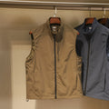 Men's thin nylon vest in army green with side seam pockets and a straight retro cardigan cut.