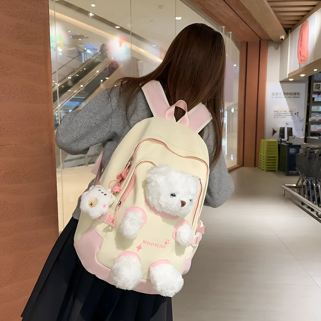 Nylon school backpack in macaron colour with curved shoulder strap and pendant, 20-35L capacity