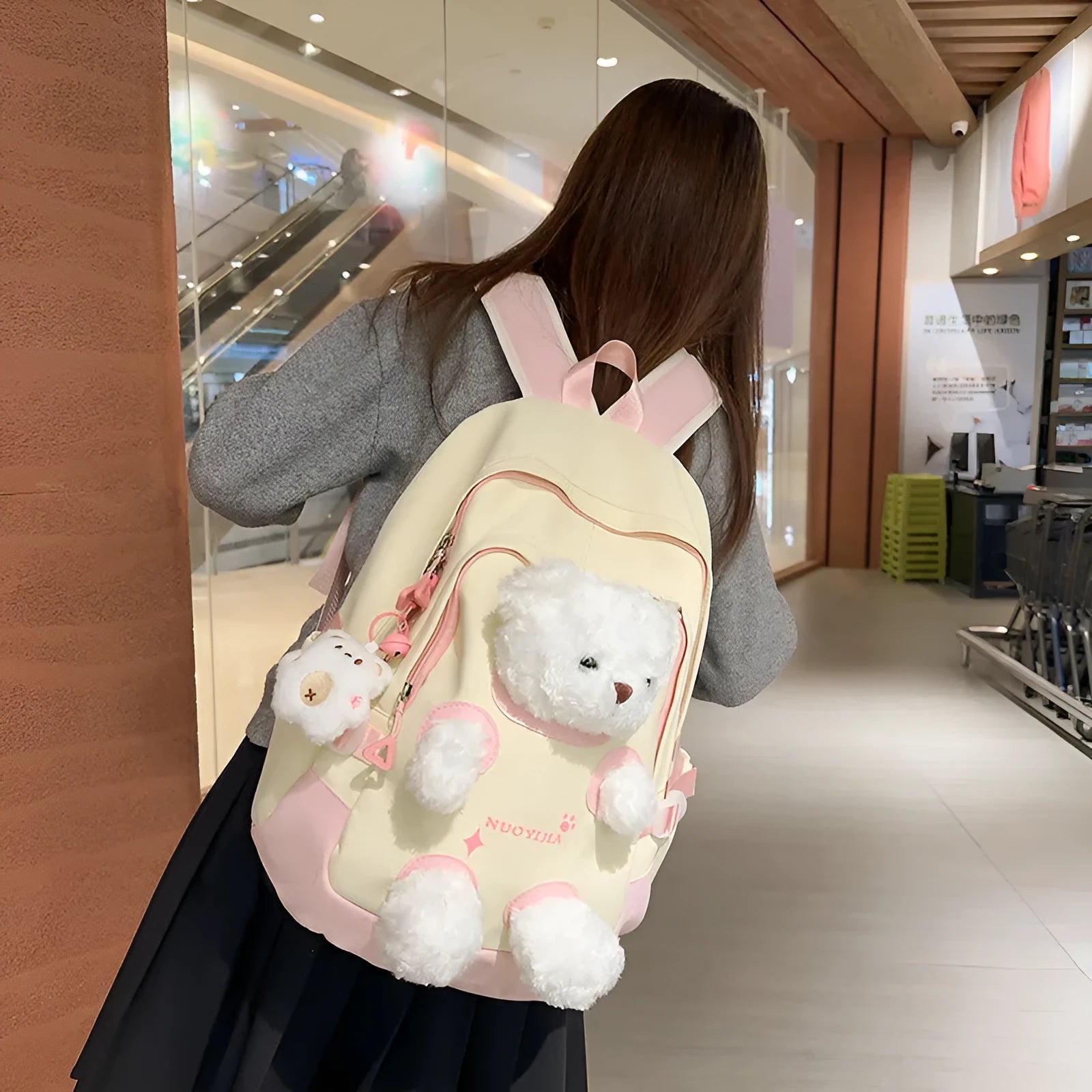 Nylon school backpack in macaron colour with curved shoulder strap and pendant, 20-35L capacity