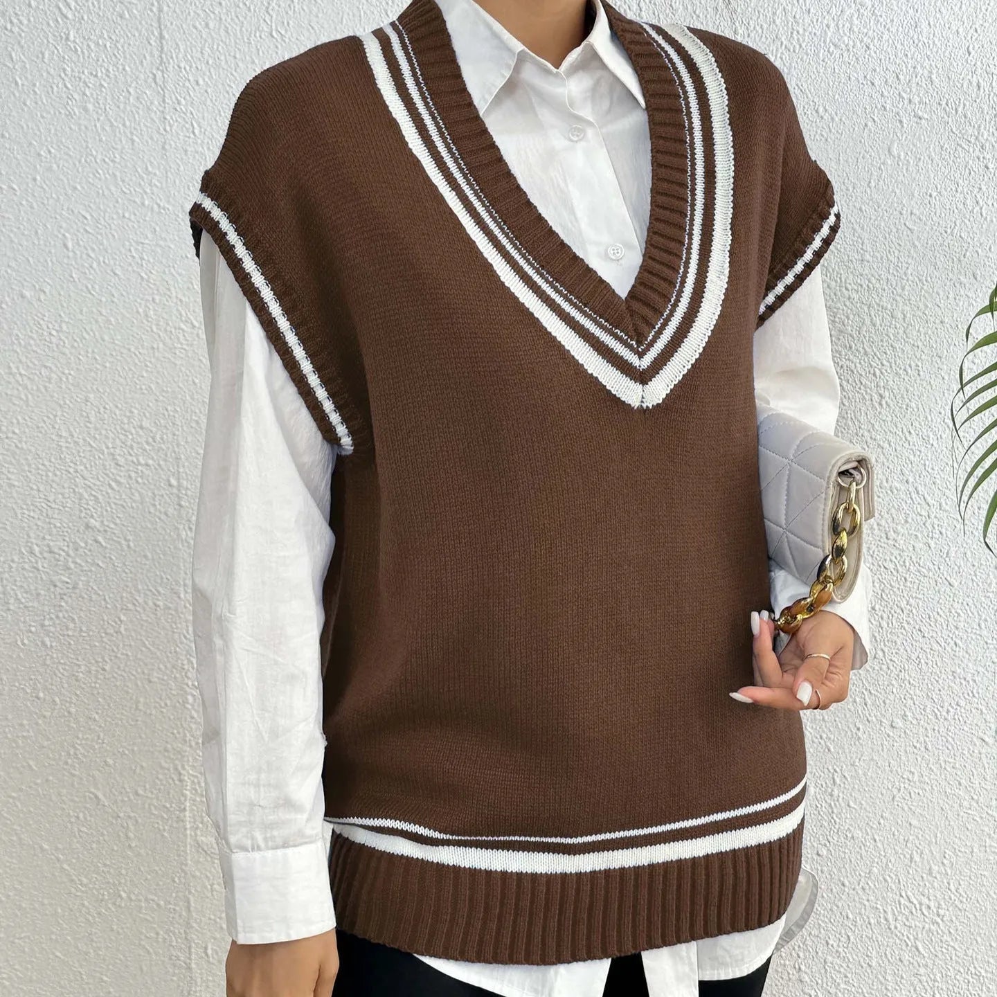 Women's college style loose fit vest sweater in black, blue, and coffee colour options