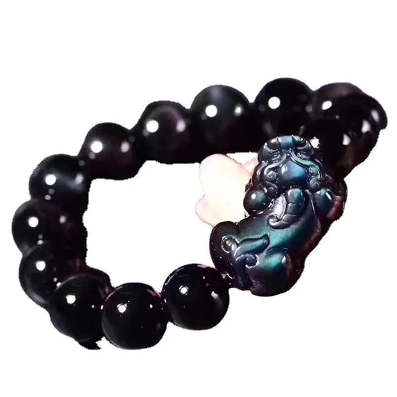 Natural ice colour eye obsidian crystal bracelet showing polished beads with characteristic banding patterns