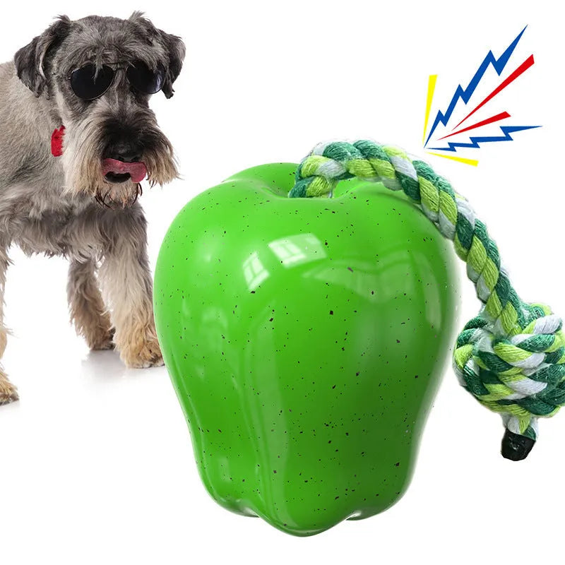 Green apple-shaped plastic dog toy with food dispensing ball compartment for interactive chewing play
